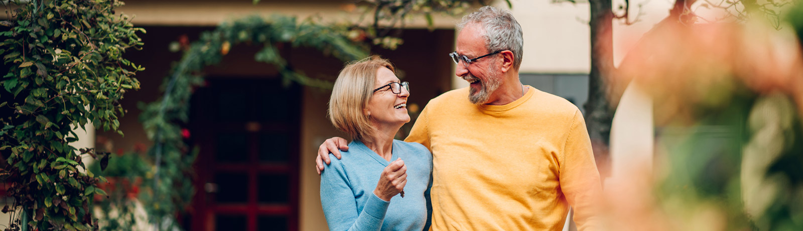 Mature couple enjoying time in back yard