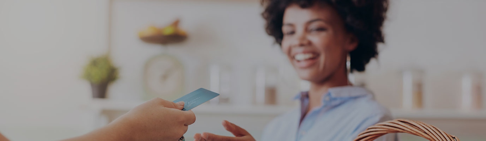 a woman making a debit or credit card purchase