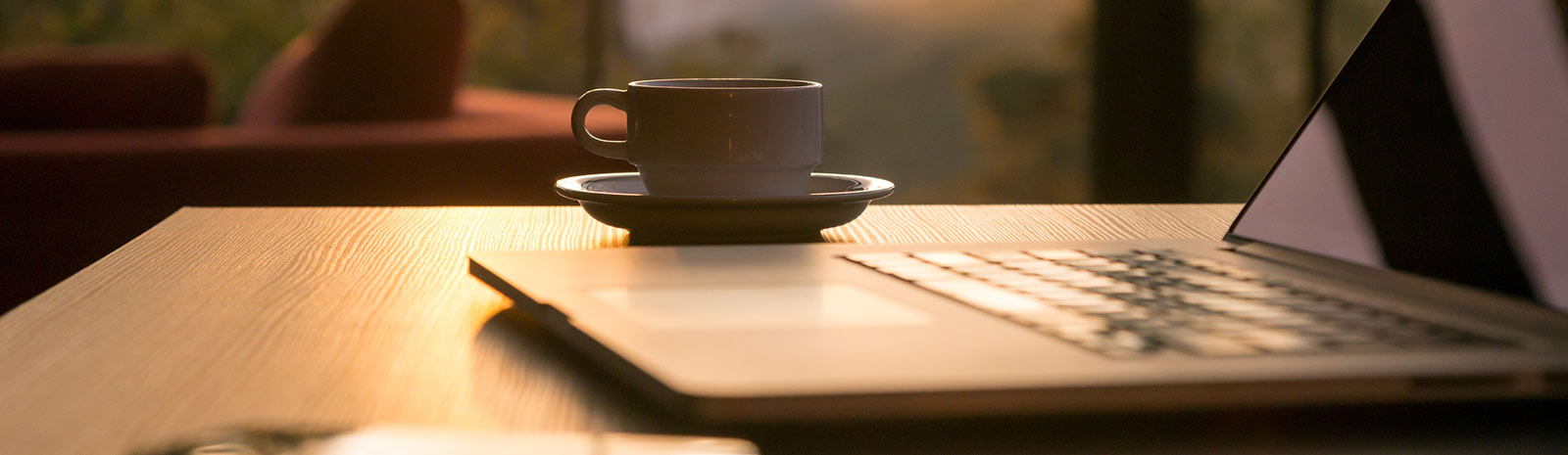 laptop computer and a cup of coffee