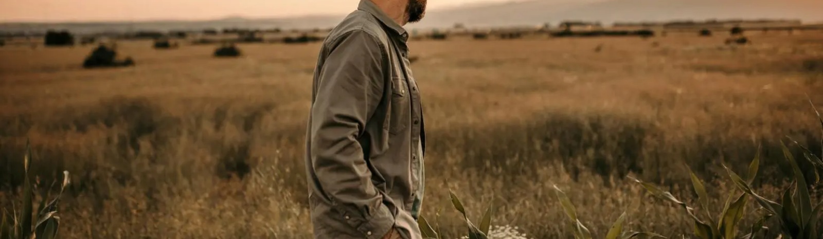 a farmer walking through a field